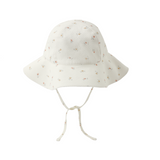 White floral-patterned sun hat on a white background